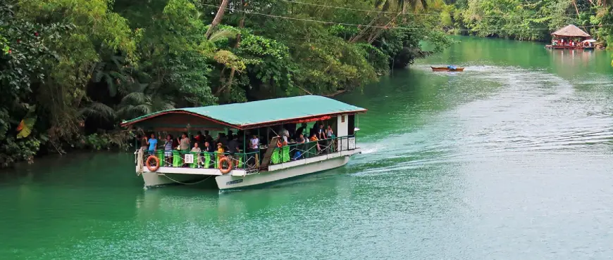 Bohol tour featuring tarsier sanctuary visit, Loboc River cruise, and scenic island landscapes